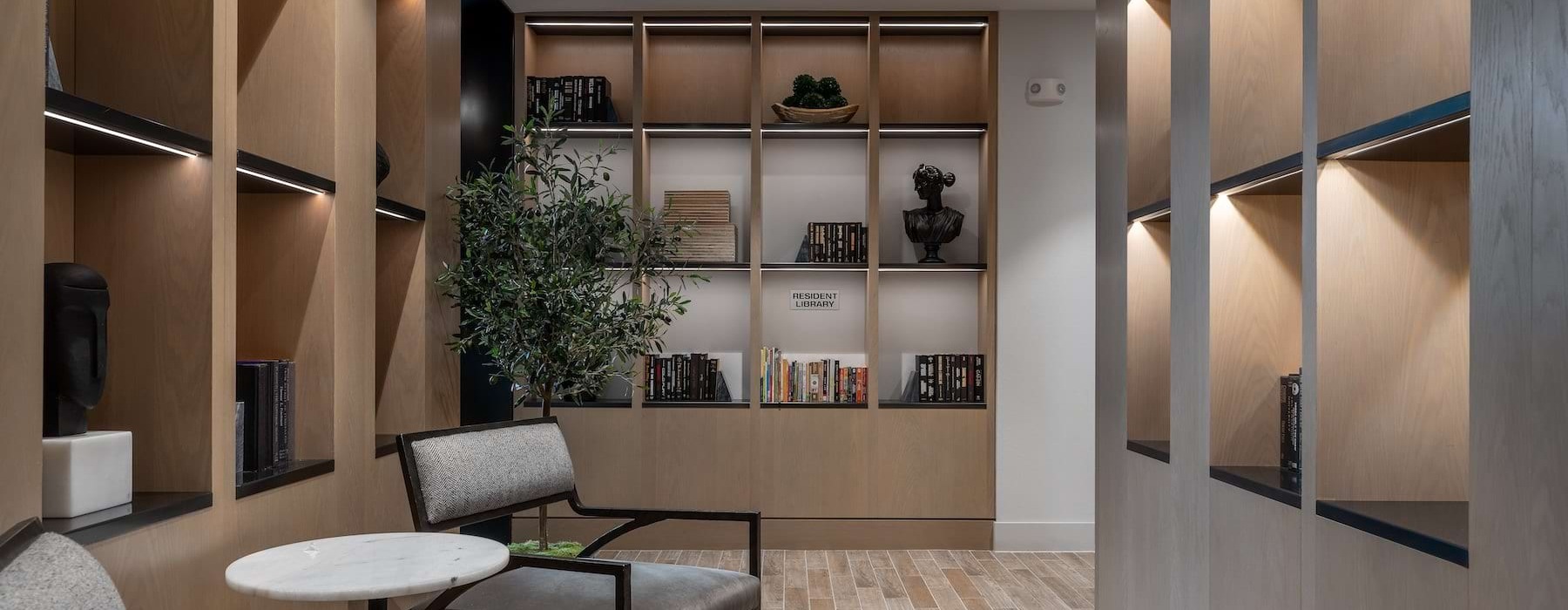 a room with shelves and chairs